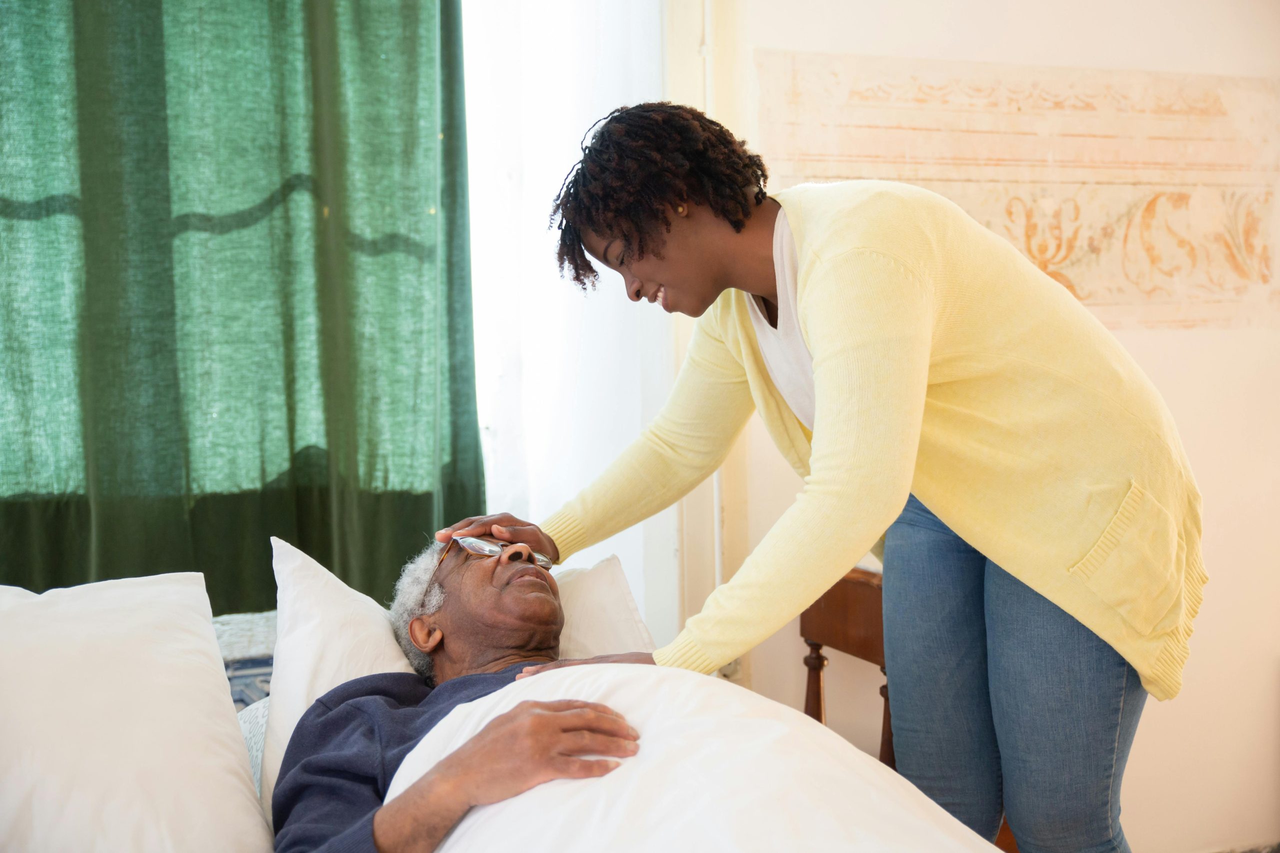 nurse_with_old_man_on_bed